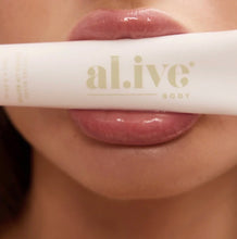 Load image into Gallery viewer, A super rich, moisturising lip butter that nourishes and softens lips, while adding a perfectly subtle pink tint. 

Featuring lychee fruit and botanical extracts, this buttery formula effortlessly melts into lips to seal in moisture for softer more supple